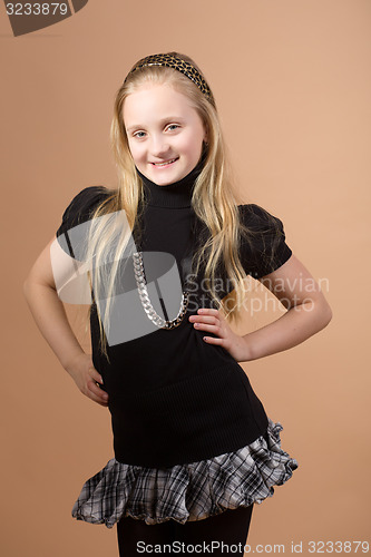 Image of Fashion smiley european little girl posing