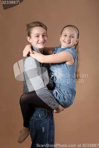 Image of Fashion smiley european siblings posing