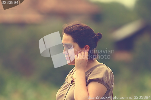 Image of pensive woman outdoor portrait