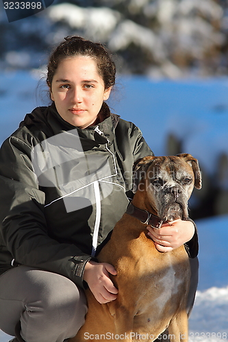 Image of young woman with boxer dog