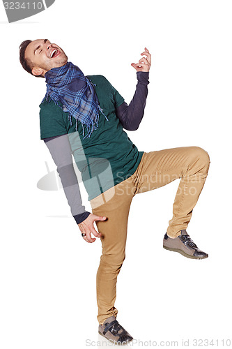 Image of Young man playing air guitar