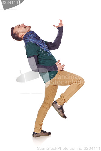 Image of Young man playing air guitar