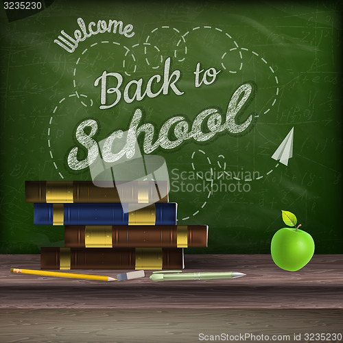 Image of School books and apple against blackboard. EPS 10