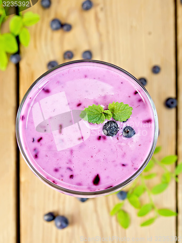 Image of Milkshake with blueberries on board top