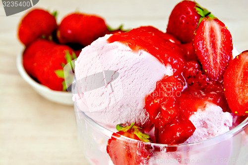 Image of Ice cream strawberry in glass bowl on fabric