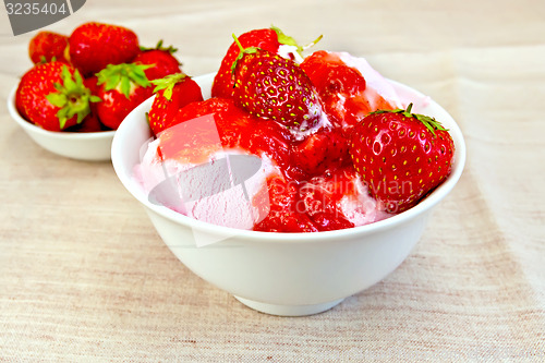 Image of Ice cream strawberry in bowl on fabric