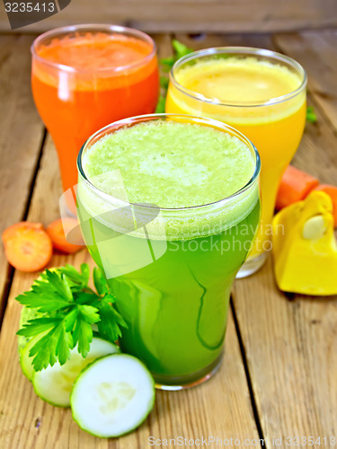 Image of Juice cucumber and vegetable in three glassful on board