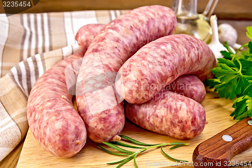 Image of Sausages pork on board with knife