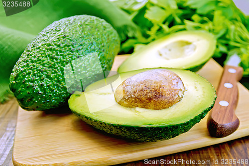 Image of Avocado with napkin on board