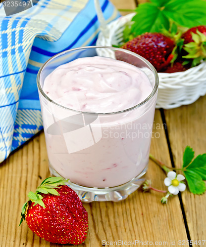 Image of Milkshake with strawberry on board