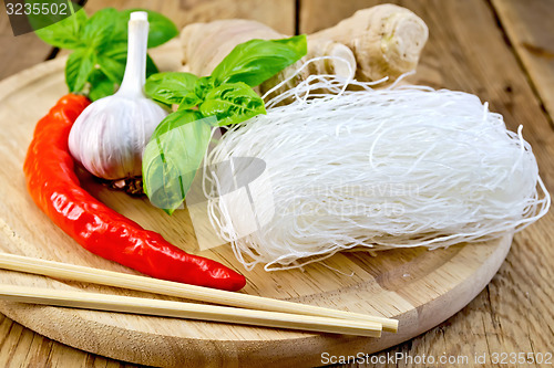 Image of Noodles rice thin with spices on board