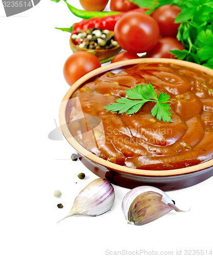 Image of Ketchup in pottery with vegetables and spices