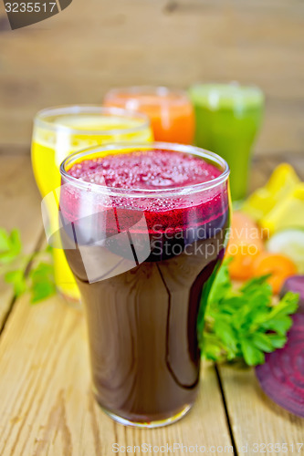 Image of Juice beetroot and vegetable with parsley on board