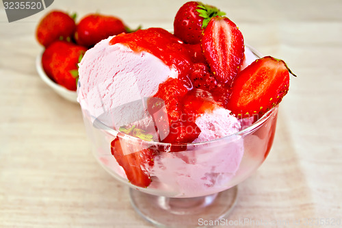 Image of Ice cream strawberry in glass bowl with berries on fabric