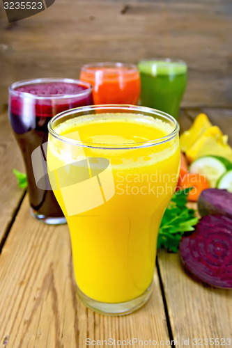 Image of Juice pumpkin and vegetable in glassful on board