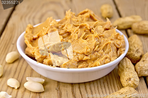 Image of Butter peanut in bowl on board