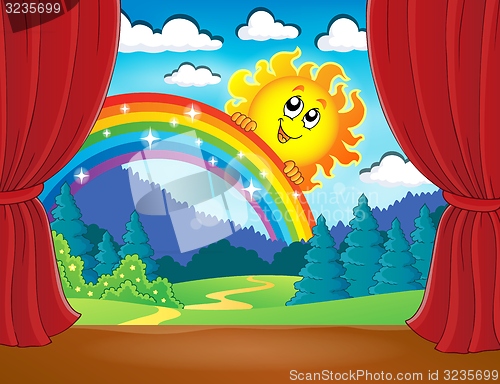 Image of Stage with rainbow and sun