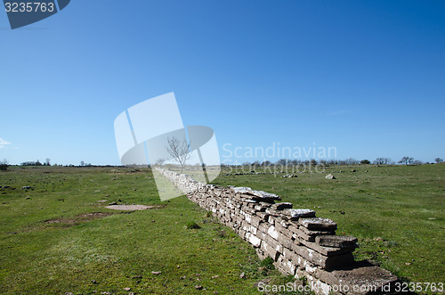 Image of Plain grassland with stone wall
