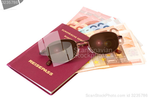 Image of Passport with sunglasses and money