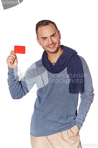 Image of Smiling casual man showing blank credit card