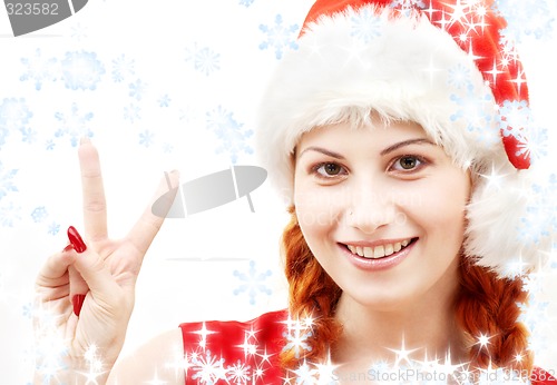 Image of santa helper showing victory sign with snowflakes