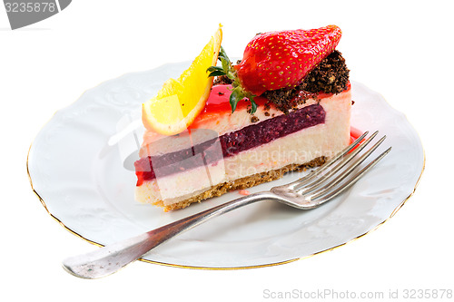 Image of Piece of cake with a fresh strawberry and orange.