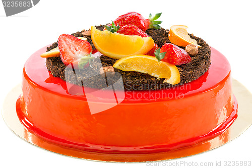 Image of Cake with strawberries and orange slices.