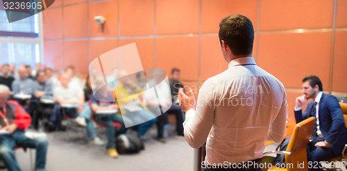 Image of Speaker at Business Conference and Presentation.