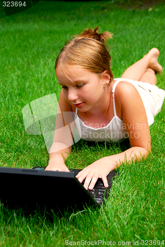 Image of Girl computer grass