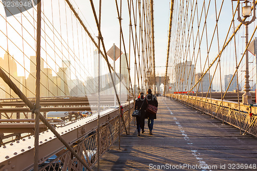 Image of Brooklyn bridge at sunset, New York City.