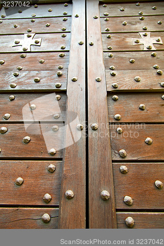 Image of  cross lombardy   arsago seprio  blur  in a  door curch  closed 