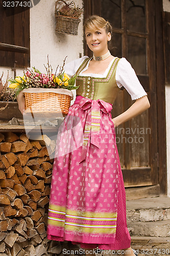 Image of Young girl with Easter bouquet Bavarian