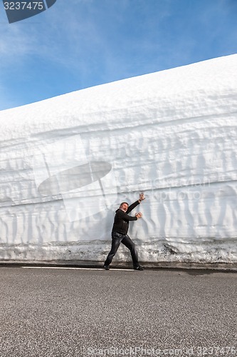 Image of highway along the snow wall. Norway in spring