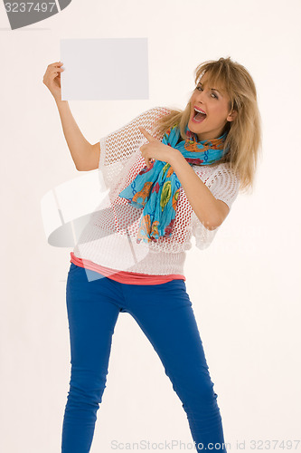 Image of Stylish woman points at a blank sign