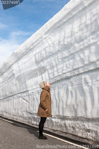 Image of highway along the snow wall. Norway in spring