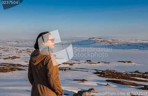 Image of The girl on the background of snow-covered plains
