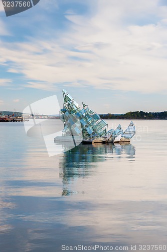 Image of OSLO - May 4, 2011. She Lies is the name of a floating glass and steel construction that turns with the wind and tide, created by Monica Bonvicini