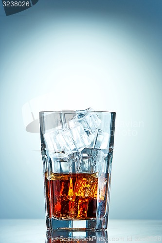 Image of Glass of cola with ice cubes