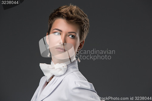 Image of portrait of an elegant young doctor in a white coat 