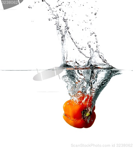 Image of Pepper drops into a water 