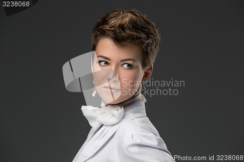 Image of portrait of an elegant young doctor in a white coat 