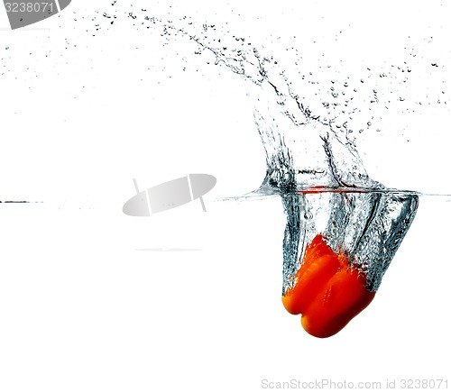 Image of Pepper drops into a water 