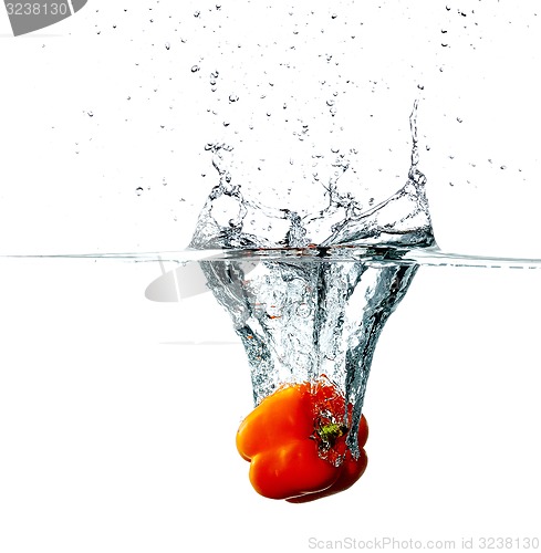 Image of Pepper drops into a water 