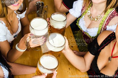 Image of Bavarian girls drinking beer