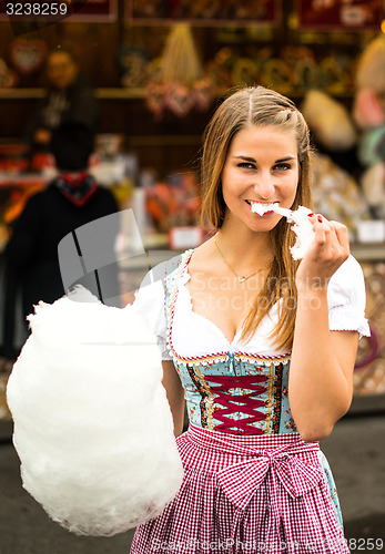 Image of Beautiful woman with cotton candy 