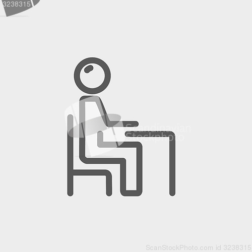 Image of Student sitting on a chair in front of his table thin line icon