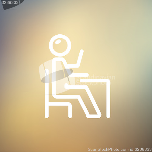 Image of Student sitting on a chair in front of his table thin line icon