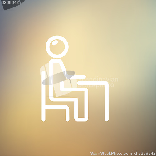 Image of Student sitting on a chair in front of his table thin line icon