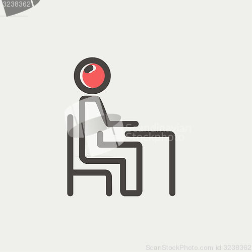 Image of Student sitting on a chair in front of his table thin line icon