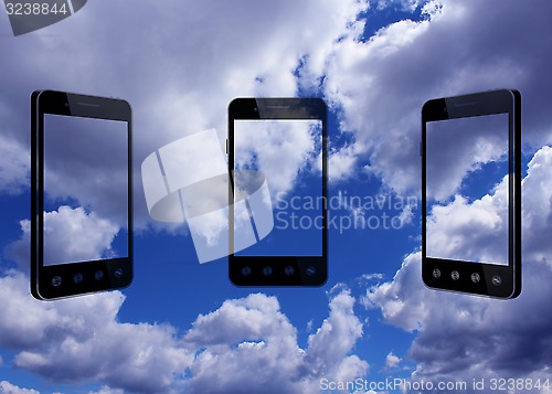 Image of smart-phones transparent on blue sky background